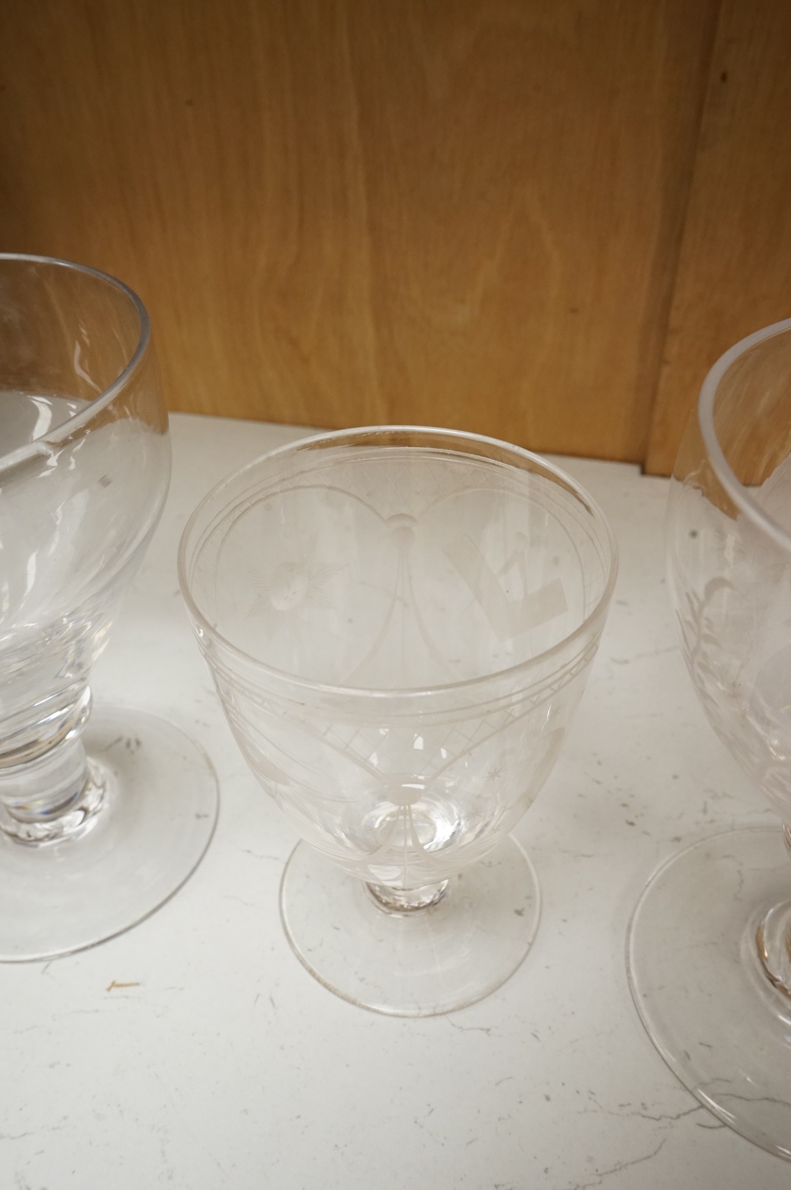 Two 19th century glass rummers and a smaller Masonic drinking glass, tallest 14cm